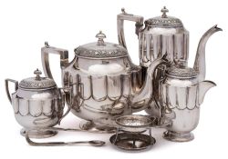 An Indian silver four-piece tea and coffee service, unmarked: of lobed oval outline,