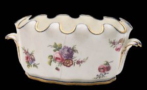A pair of Sèvres porcelain verrières: each of lobed oval form with crenellated rim and scroll