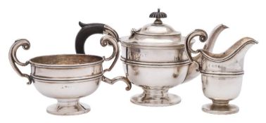 A George V silver three-piece tea service, maker's marks worn, Birmingham,