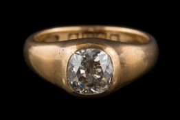 A gentleman's 18ct gold and diamond single-stone ring: the cushion-shaped old brilliant-cut diamond