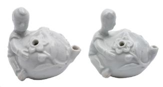 A pair of Chinese blanc-de-Chine water droppers: each in the form of a boy climbing a large peach,