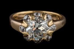 A late 19th century gold and diamond ring: the principal cushion-shaped old,