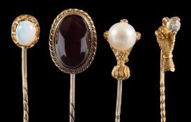 A button pearl mounted stick-pin and three others: the pearl (untested) approximately 8mm diameter,