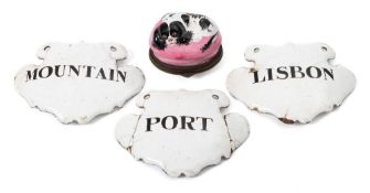 A Bilston enamel dog's head patch box and a set of three black on white enamel Port/Lisbon/Mountain