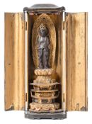 A 19th century Chinese carved gilt wood shrine figure: possibly Guan Yin,