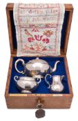 A Victorian silver presentation three-piece tea service, maker Edward & John Barnard, London,