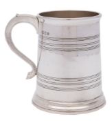 A George VI silver mug, maker's mark worn, London, 1942: of plain cylindrical form,