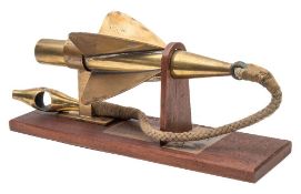 A brass 'Cherub' rotator by Thomas Walker:, number '244' mounted on a wooden display plinth, 43.