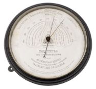A late 19th /early 20th century Spanish bulkhead barometer by Estrella del Norte:,