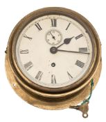 A brass cased bulkhead clock:, the single barrel movement with white dial,