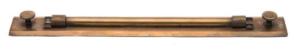An Admiralty pattern brass rolling rule:, unsigned, uncased, 45.9cm long.