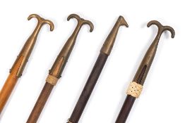 Ray Tucknot. a group of four ropework decorated boat hooks:.