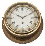 A circular brass bulkhead 'Master' clock:,