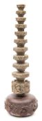 An 18th century Dutch Mast Wortel:, of eleven tapering tiers with carved cherubic figures,