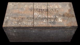 A large wooden seaman's trunk belonging to F E C Davies: with overwritten hand painted addresses,