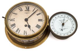 A brass eight day bulkhead clock by Smiths, London:, white enamel dial with Roman numerals,