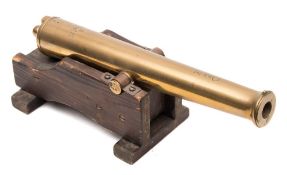 A 20th century brass model of a cannon:,