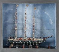 A 19th century cased ship model 'Falcon':, standing rigged over deck with davits and lifeboats,