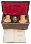 A WWII period Royal Navy Regulation bicorn hat and epaulettes in Russian lacquer trunk:,