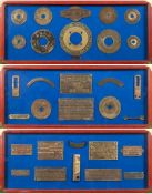 A collection of salvaged ships' brass plaques:, mounted in three framed display boards,