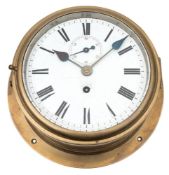 A ship's brass bulkhead clock:, unsigned,