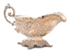 A Continental silver pedestal gravy boat, bears import marks for Eustace Parker, London,