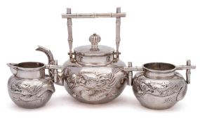 A late 19th century Chinese silver three-piece tea service, maker Wang Hing & Co,