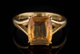 A rectangular topaz single-stone ring: approximately 11mm long x 9mm wide x 4mm deep,