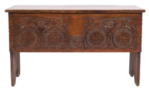 An 18th century oak rectangular plank coffer:, with a plain hinged top,
