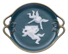 A small pate-sur-pate teal-blue ground dish: with foliate branch handles,