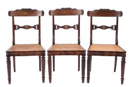 A set of three Regency carved rosewood dining chairs:,