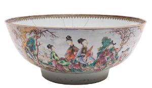 A Chinese famille rose punch bowl: enamelled and gilt with panels of groups of figures,