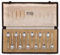 Omar Ramsden - a set of twelve beaten silver coffee spoons, London,
