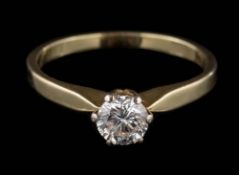 A 14ct gold and diamond solitaire ring: the round, brilliant-cut diamond estimated to weigh 0.
