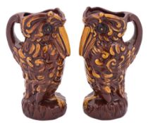 A pair of Longpark (Torquay) grotesque bird jugs: modelled standing with beak on chest,