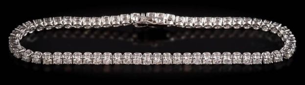 An 18ct white gold and diamond tennis bracelet: with 62 round brilliant-cut diamonds,