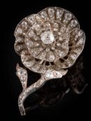 A Victorian diamond rose flower brooch: designed as a single bloom,