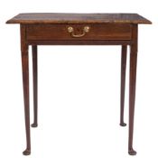 An 18th century oak rectangular side table: with a burr figured overhanging top,