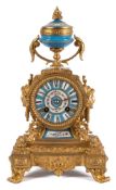 A 19th century French gilt-metal and porcelain French 19th century mantel clock: the eight-day