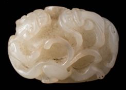 A Chinese jade 'chilong' carving: of domed form carved overall with two opposing chilong,