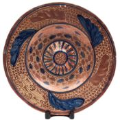A Hispano Moresque charger: probably Manises of circular form with an embossed rim and central boss
