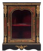 A 19th Century French ebonised and gilt metal mounted pier cabinet:,