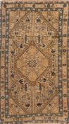 A Karabagh rug: the beige hexagonal field with a central hexagonal medallion,