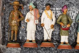 A collection of twenty four Indian Raj plaster and terracotta educational figures: depicting