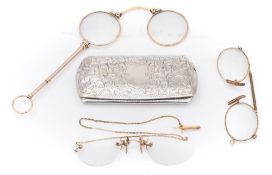 A pair of gilt rimmed spectacles contained in a silver case:,