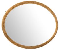 A Victorian giltwood and gesso oval mirror of large size,