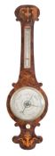 An Edwardian rosewood wheel barometer with inlaid decoration: the eight-inch round silverted dial
