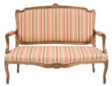 A carved giltwood canape in the Louis XV taste:,