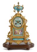 A 19th century French gilt-metal and porcelain mantel clock: the eight-day duration movement