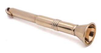 A 9ct gold cigar piercer: of trumpet-shaped outline, 6.5cm, long, 8.06gms.